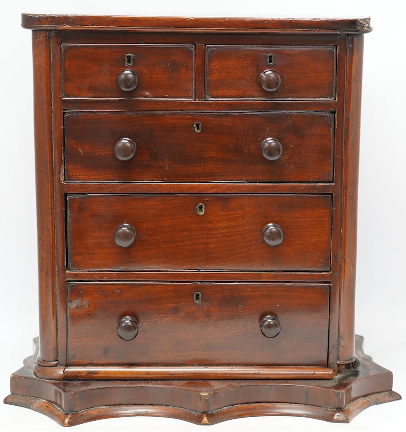 A Victorian mahogany miniature chest, on shaped plinth, 50cm wide, 49cm high. Condition - fair